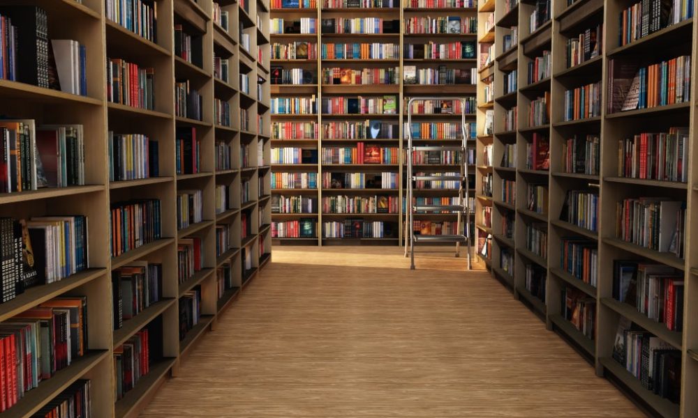 Los Angeles, CA / USA - Sept. 29, 2019: Many English language books are shown organized on metal shelves in a public library.